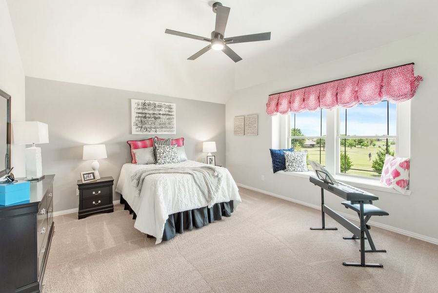Bedroom with ceiling fan, carpet flooring, window seat, and keyboard piano near large window with outdoor view