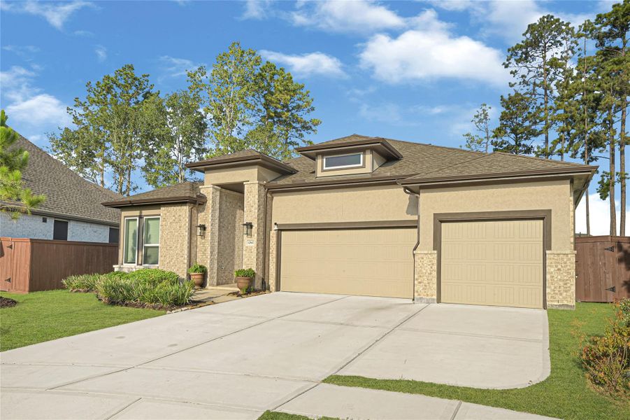 Front exterior of a new home in Evergreen 40s, Conroe, TX, highlighting curb appeal (Image 22). Front exterior of a new home in Evergreen 40s, Conroe, TX, highlighting curb appeal (Image 22).