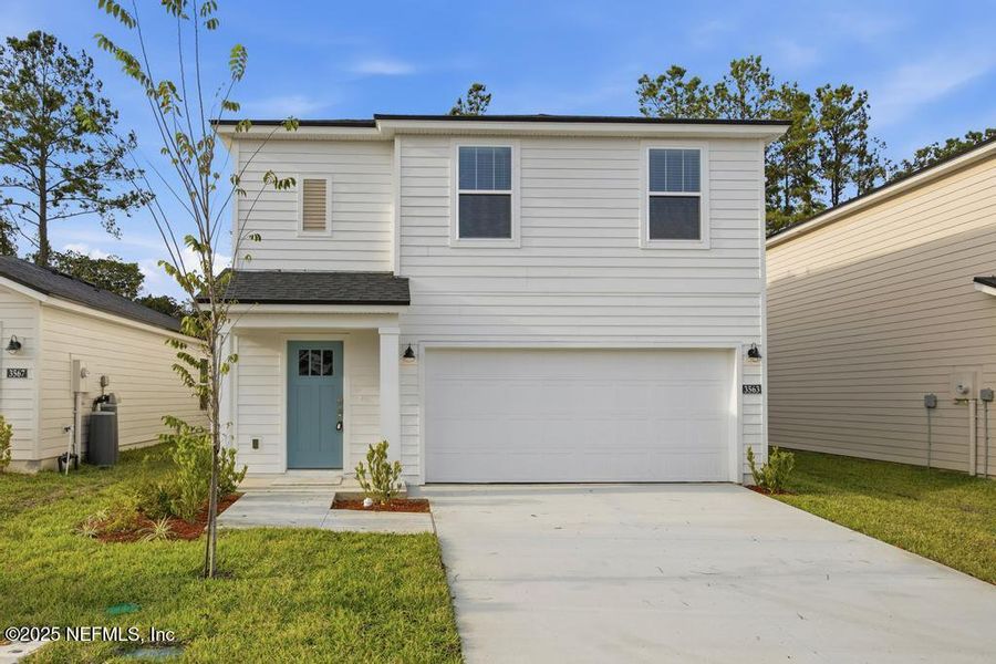 Front exterior of a new home in Kings Landing, Jacksonville, FL, highlighting curb appeal (Image 1). Front exterior of a new home in Kings Landing, Jacksonville, FL, highlighting curb appeal (Image 1).