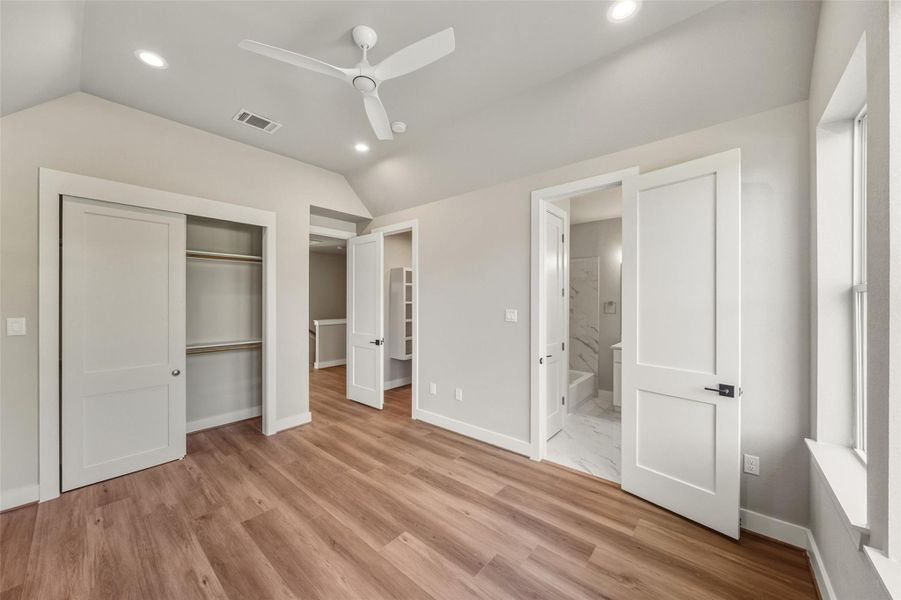 Discover the master bedroom's luxury with a spacious walk-in closet and an additional secondary closet, offering ample storage and style.