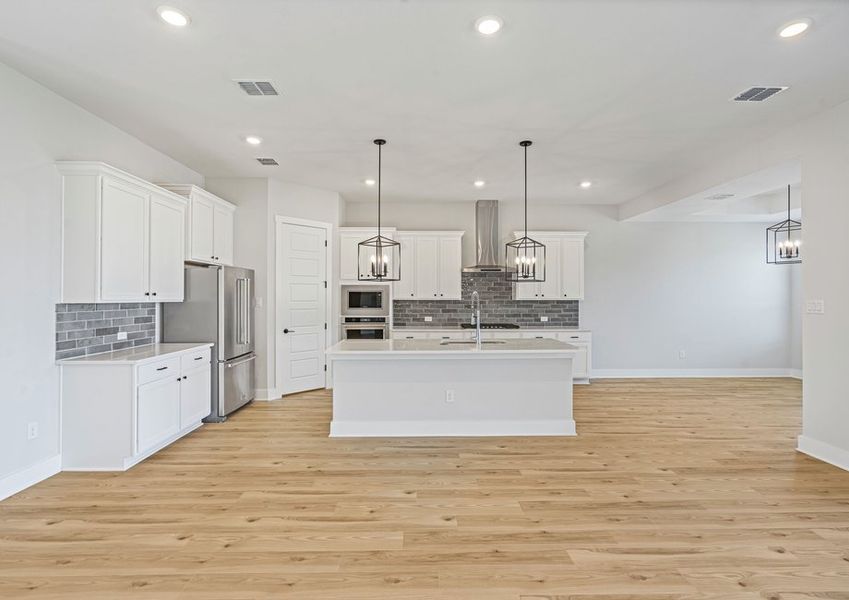 The kitchen has beautiful white wood cabinetry. The kitchen has beautiful white wood cabinetry.