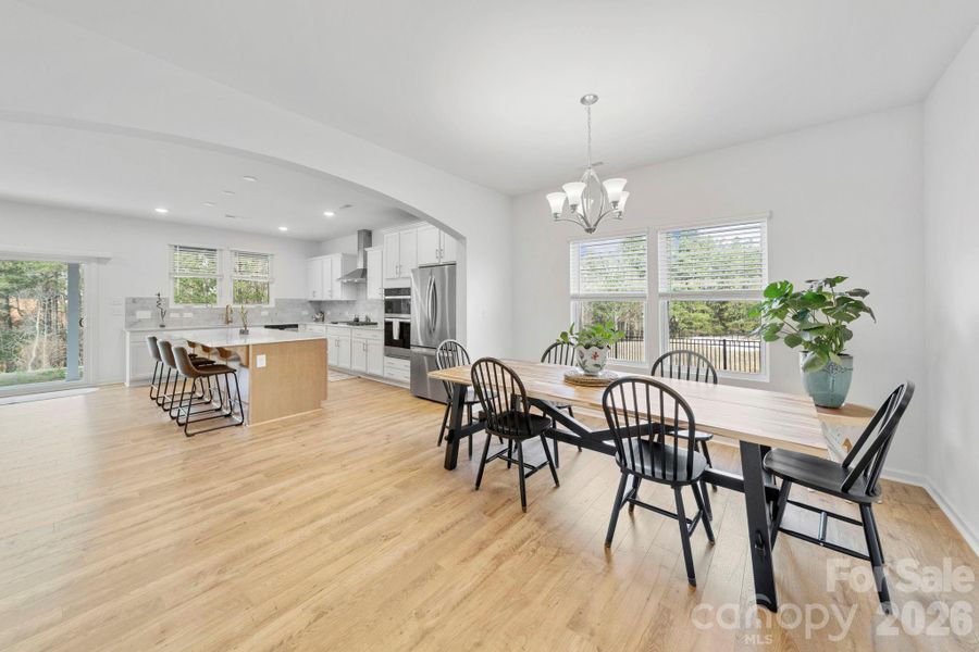 Dining Room and Kitchen with Sustainable Wood Laminate Floors
