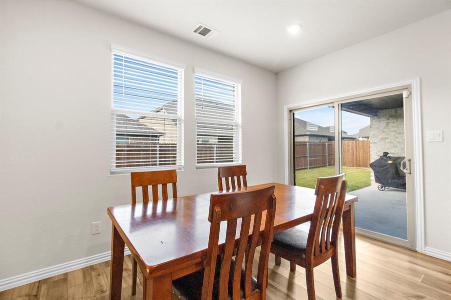 Dining area featuring light wood-style flooring and baseboards Dining area featuring light wood-style flooring and baseboards