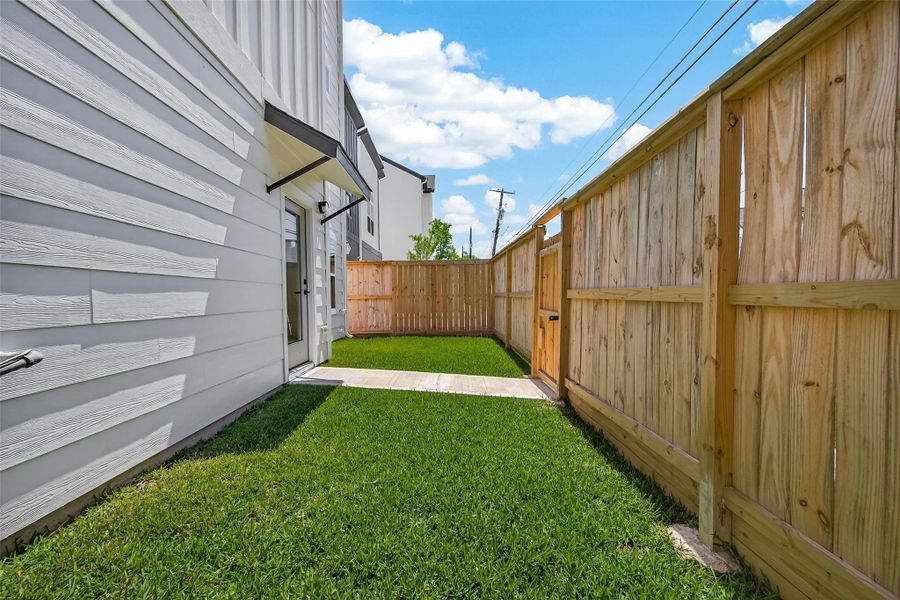 Exterior details and patio area of a home in , Houston (Image 2). Exterior details and patio area of a home in , Houston (Image 2).
