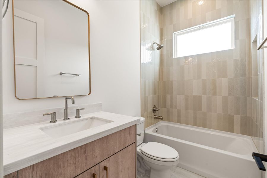 Practical and clean, this bathroom is sized to comfortably serve the secondary bedrooms without feeling like an add-on. It's built for real daily use, not just for showing well.
