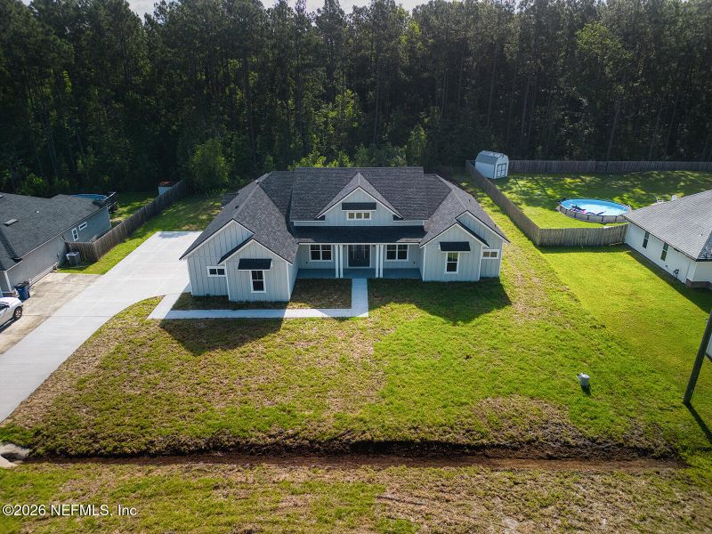 Front exterior of a new home in , Yulee, FL, highlighting curb appeal (Image 26).