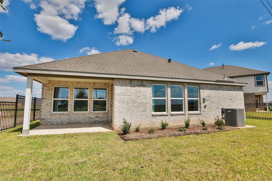Exterior details and patio area of a home in Sunterra, Katy (Image 14). Exterior details and patio area of a home in Sunterra, Katy (Image 14).