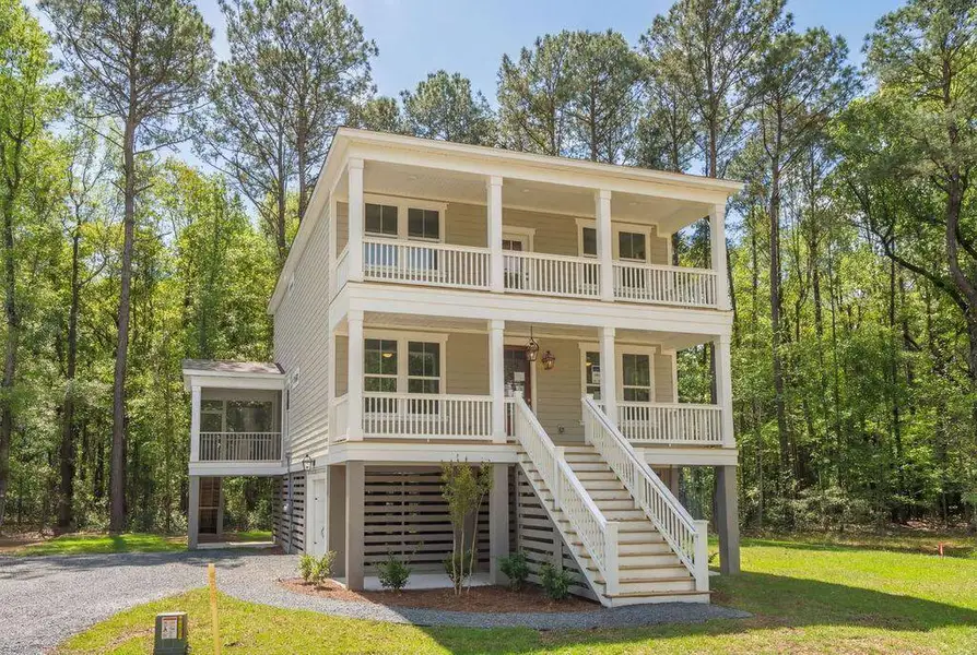 Front exterior of a new home in Kings River Preserve, Hollywood, SC, highlighting curb appeal (Image 2). Front exterior of a new home in Kings River Preserve, Hollywood, SC, highlighting curb appeal (Image 2).