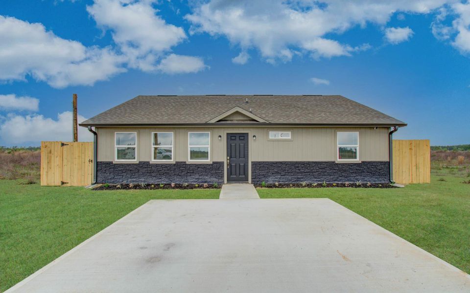 Front exterior of a new home in , Cleveland, TX, highlighting curb appeal (Image 13).