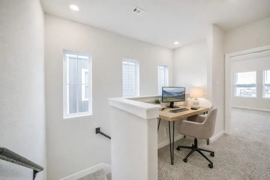 At the top of the 2nd floor stairs is this useful nook that could house a desk / office area. (virtually staged) At the top of the 2nd floor stairs is this useful nook that could house a desk / office area. (virtually staged)