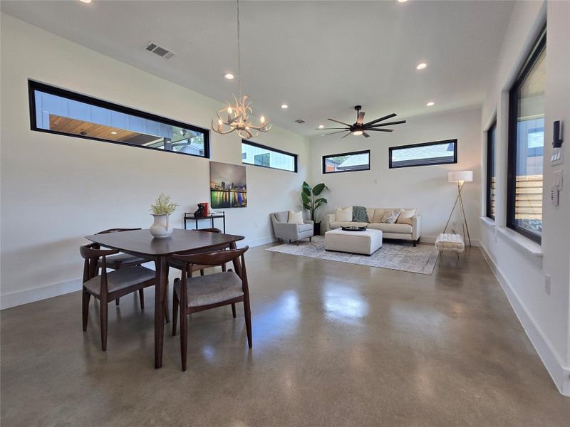 Set up the living space as you wish - lots of space for dining, living, or play areas. Lots of windows throughout, uppers for light and privacy from neighbors, and huge windows to your back yard.