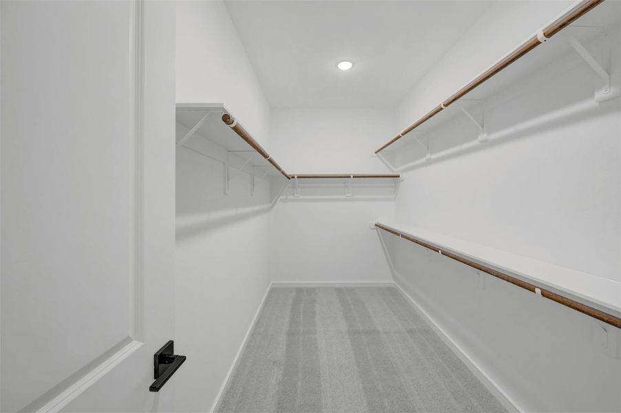 Primary walk-in closet Primary walk-in closet