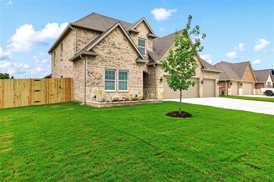 Front exterior of a new home in , Greenville, TX, highlighting curb appeal (Image 1). Front exterior of a new home in , Greenville, TX, highlighting curb appeal (Image 1).