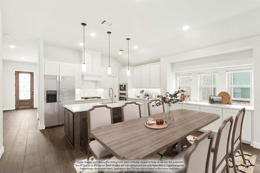 Open-concept kitchen and dining area with white cabinets, island, pendant lights, and hardwood floors Open-concept kitchen and dining area with white cabinets, island, pendant lights, and hardwood floors