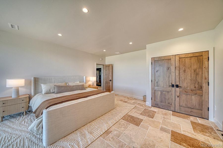 The second primary suite also includes large closet and Travertine French pattern tile. The second primary suite also includes large closet and Travertine French pattern tile.