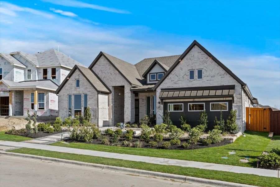 Front exterior of a new home in Berry Creek Highlands, Georgetown, TX, highlighting curb appeal (Image 27). Front exterior of a new home in Berry Creek Highlands, Georgetown, TX, highlighting curb appeal (Image 27).