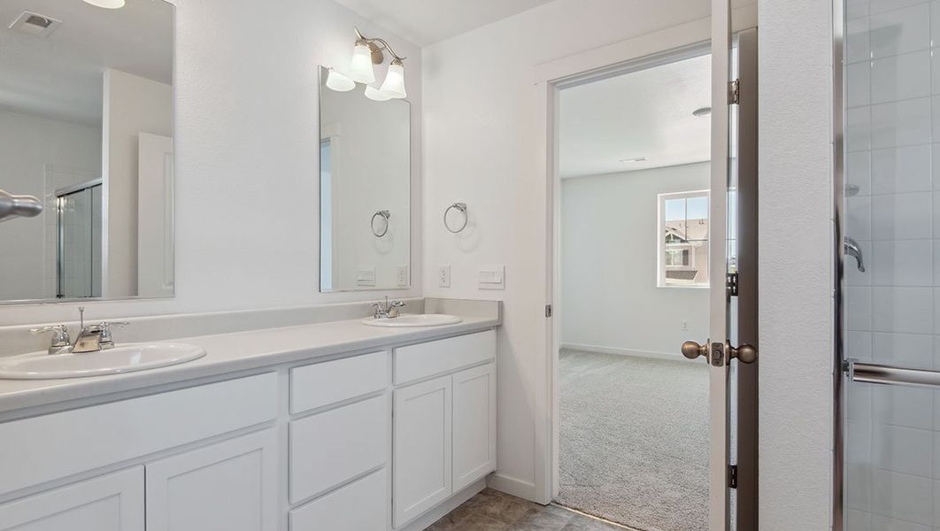 Representative furnished interior of a home built from the DOUGLAS by D.R. Horton in Horizon Uptown, Aurora (Image 10).