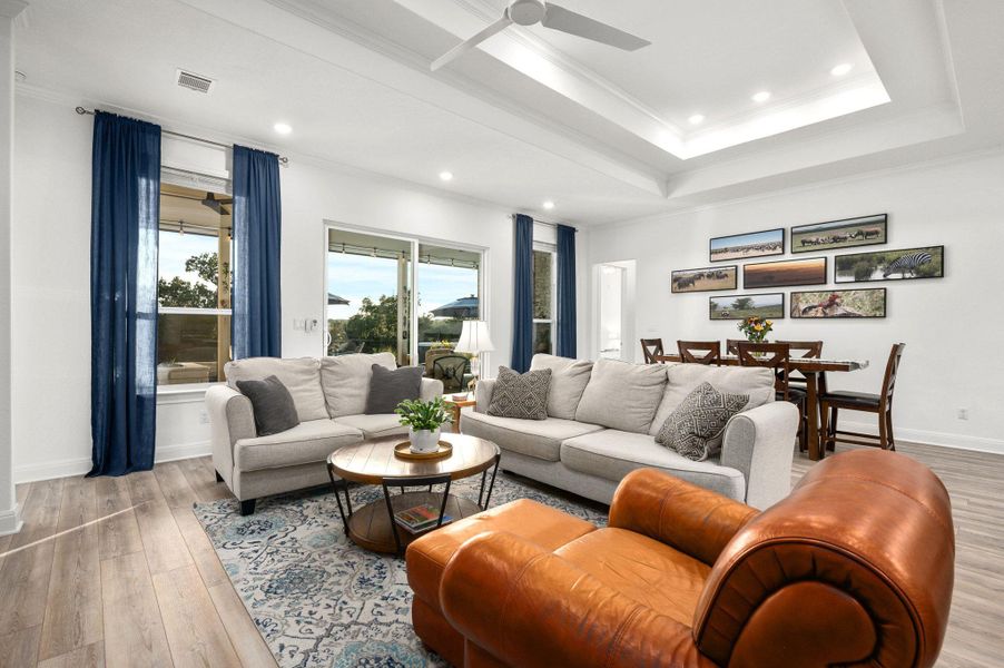 Expansive sliders seamlessly blend indoor comfort with outdoor living, leading to a custom extended patio designed for relaxation and entertaining Expansive sliders seamlessly blend indoor comfort with outdoor living, leading to a custom extended patio designed for relaxation and entertaining