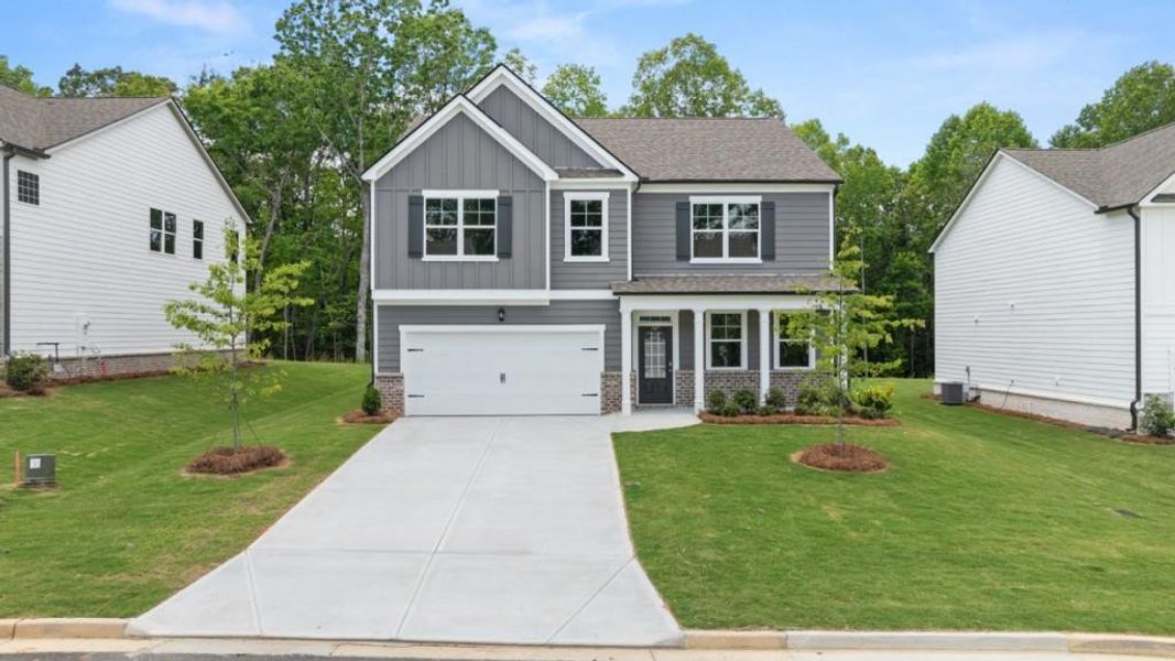 Front exterior of a new home in Parkside at Carter Grove, Cartersville, GA, highlighting curb appeal (Image 2). Front exterior of a new home in Parkside at Carter Grove, Cartersville, GA, highlighting curb appeal (Image 2).
