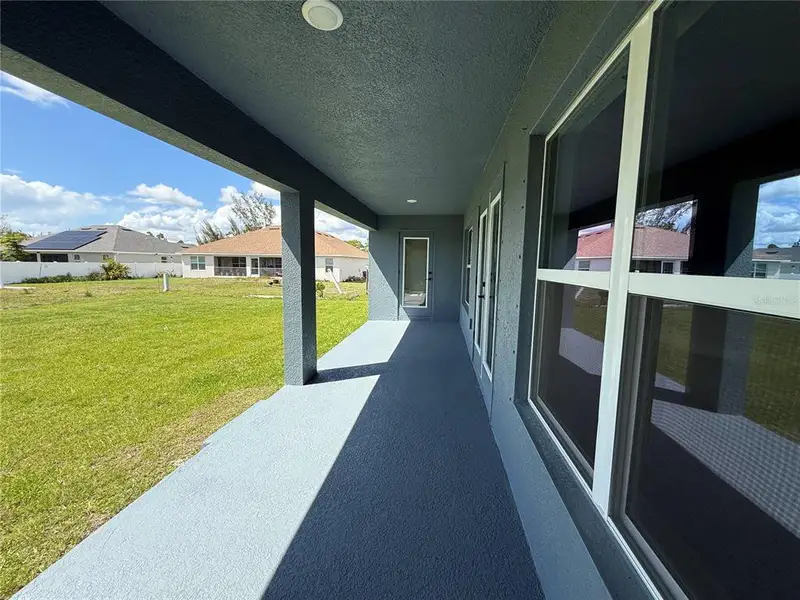 Exterior details and patio area of a home in Port Charlotte, Port Charlotte (Image 16).
