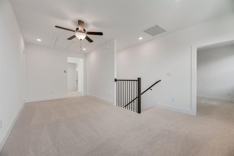 Spare room with light carpet, attic access, recessed lighting, and ceiling fan Spare room with light carpet, attic access, recessed lighting, and ceiling fan