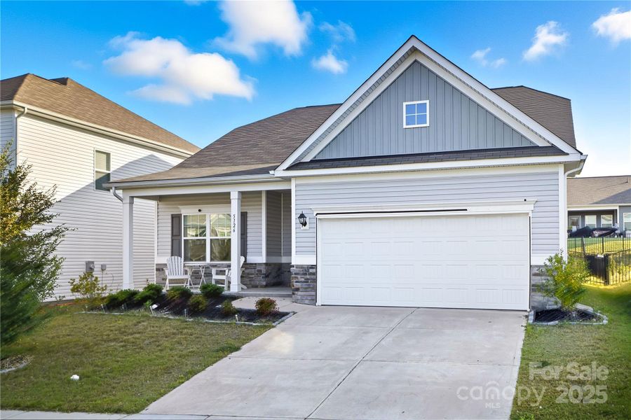 Front exterior of a new home in Orchard Creek, Charlotte, NC, highlighting curb appeal (Image 1).