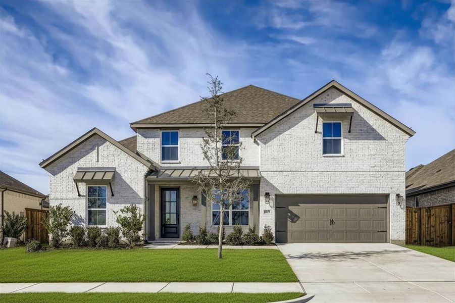 View of front facade with brick siding, a standing seam roof, driveway, and a garage