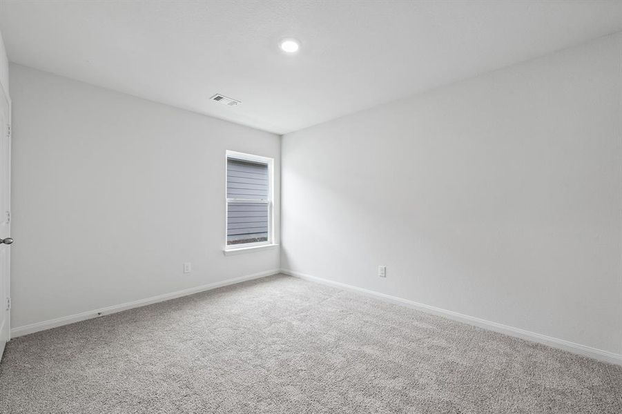 Empty room featuring carpet