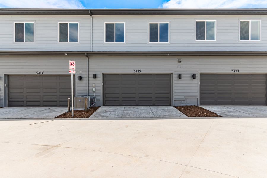 Front exterior of a new home in Painted Prairie, Aurora, CO, highlighting curb appeal (Image 2).