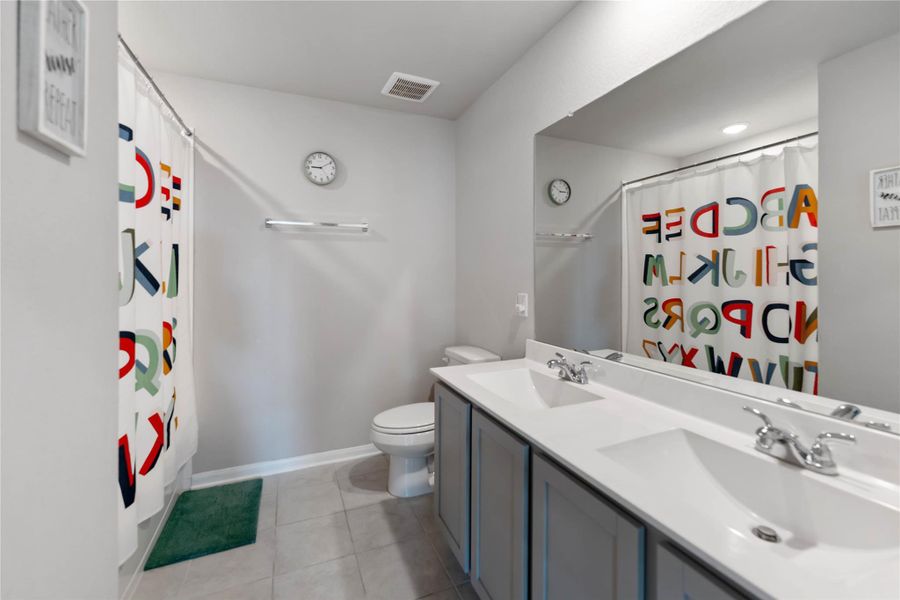 The full bath upstairs features double sinks, an upgraded vanity, and elegant finishes for a polished look. The full bath upstairs features double sinks, an upgraded vanity, and elegant finishes for a polished look.