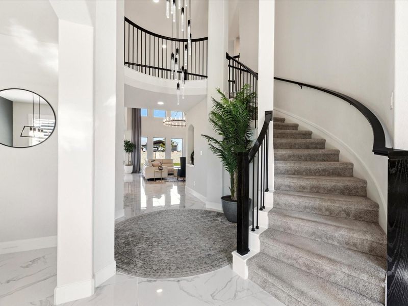 This is the Classis circular staircase with 2 story ceiling and rotunda that Perry Homes is famous for! Hand rails on both sides ensure safety on the way up and down.