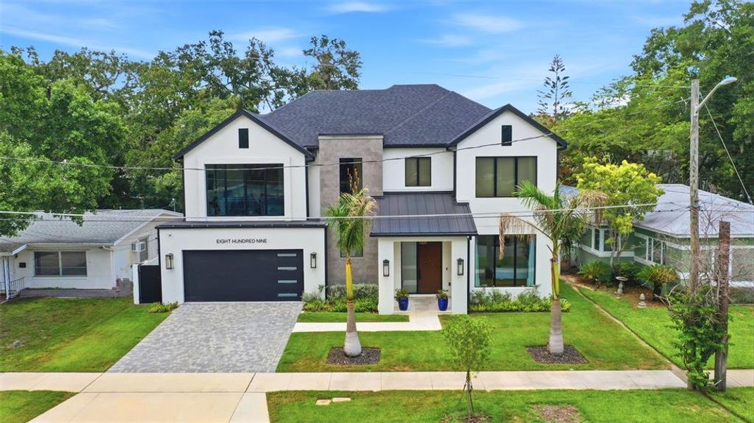 Front exterior of a new home in , Orlando, FL, highlighting curb appeal (Image 33). Front exterior of a new home in , Orlando, FL, highlighting curb appeal (Image 33).