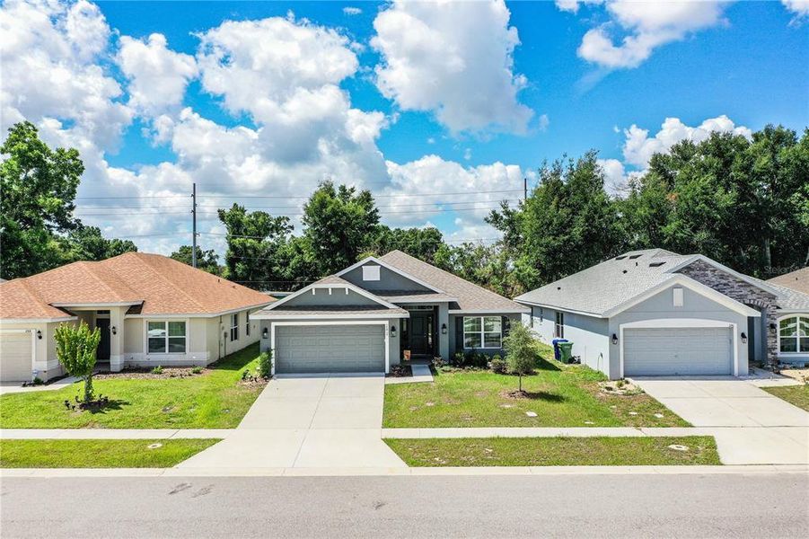Front exterior of a new home in , Winter Haven, FL, highlighting curb appeal (Image 25).