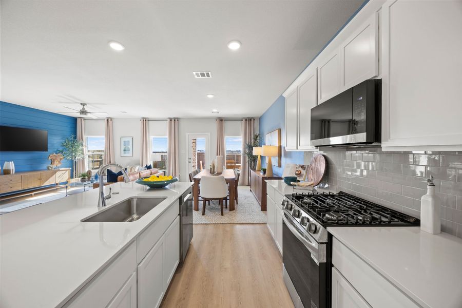 A kitchen with white cabinets. A kitchen with white cabinets.