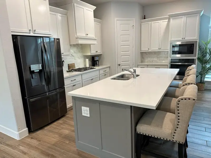 Furnished interior view inside a new home in Grand Central Park 45', Conroe (Image 9).