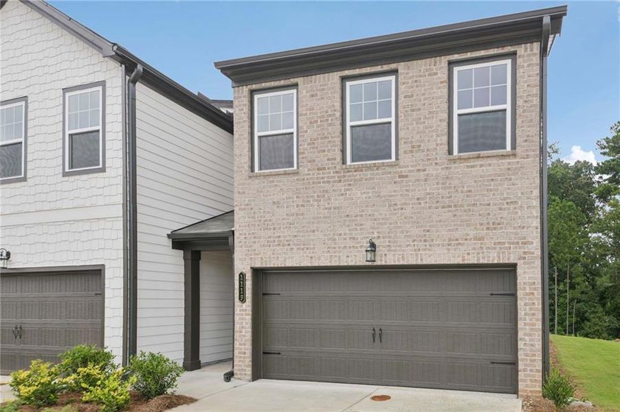 Front exterior of a new home in Laurelwood, Douglasville, GA, highlighting curb appeal (Image 2).