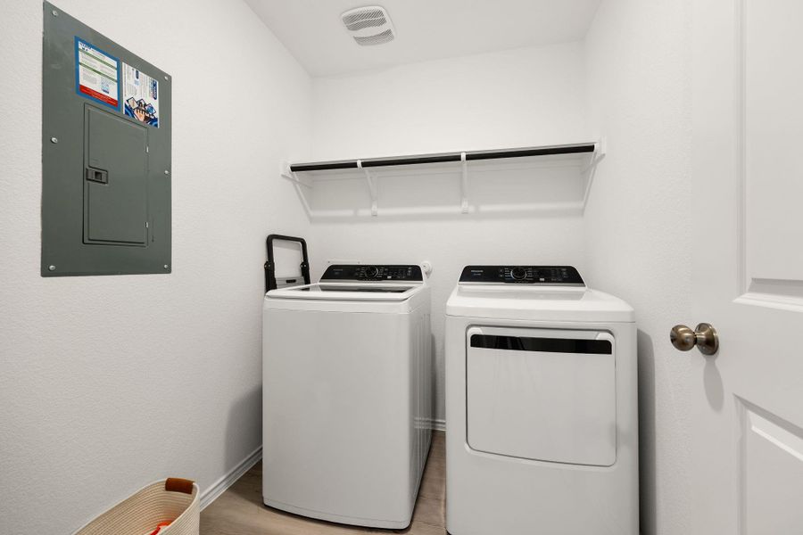 A well-appointed laundry room with modern appliances provides convenience and efficiency.