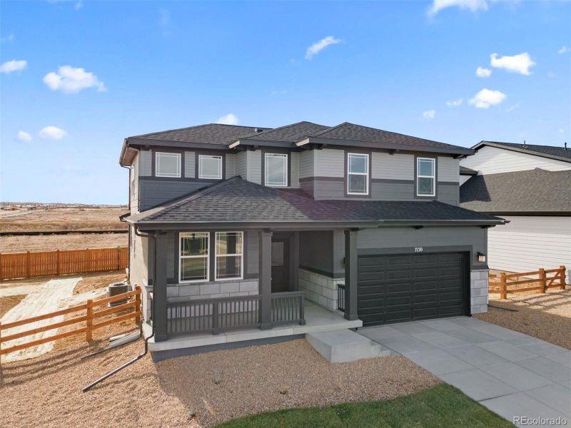 Front exterior of a new home in , Thornton, CO, highlighting curb appeal (Image 17).