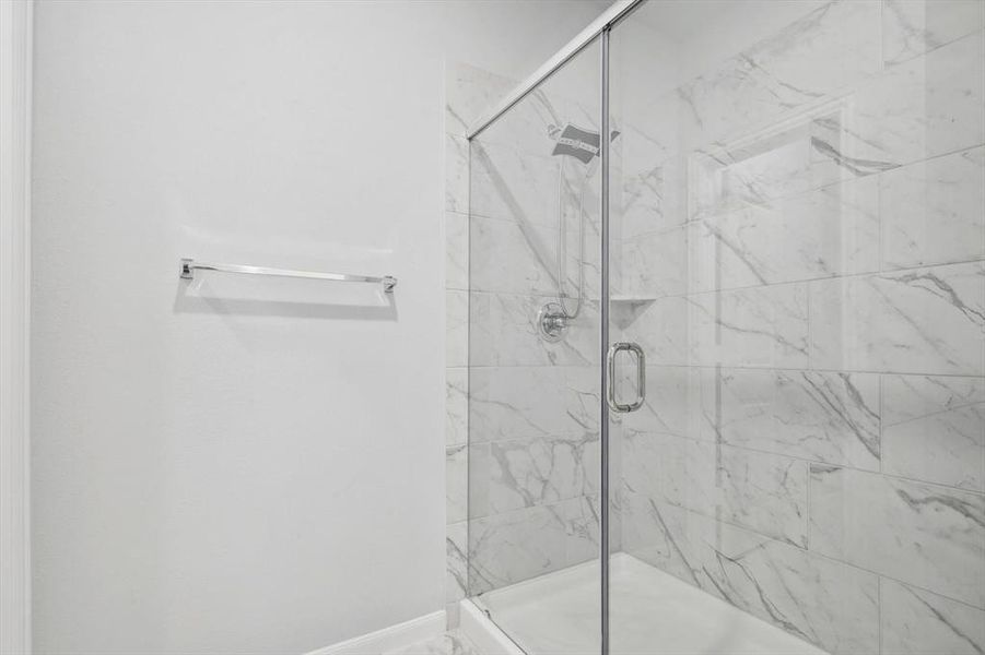 Bathroom featuring a shower with shower door