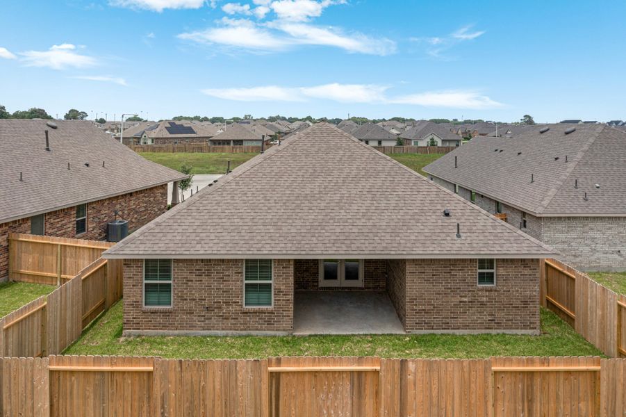 Front exterior of a new home in Bayou Maison, Dickinson, TX, highlighting curb appeal (Image 20).