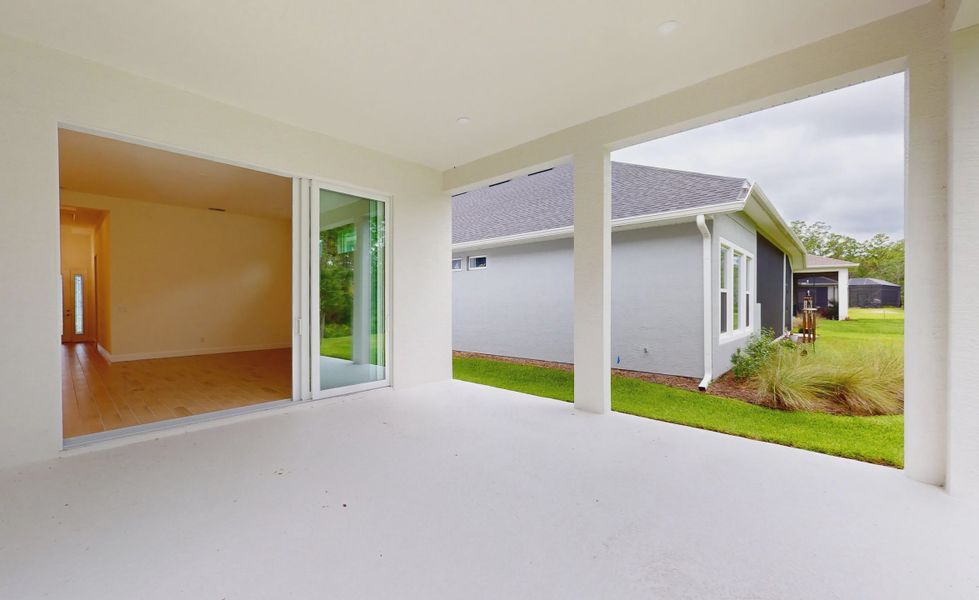 Exterior details and patio area of a home in Woodhaven, Port Orange (Image 19).