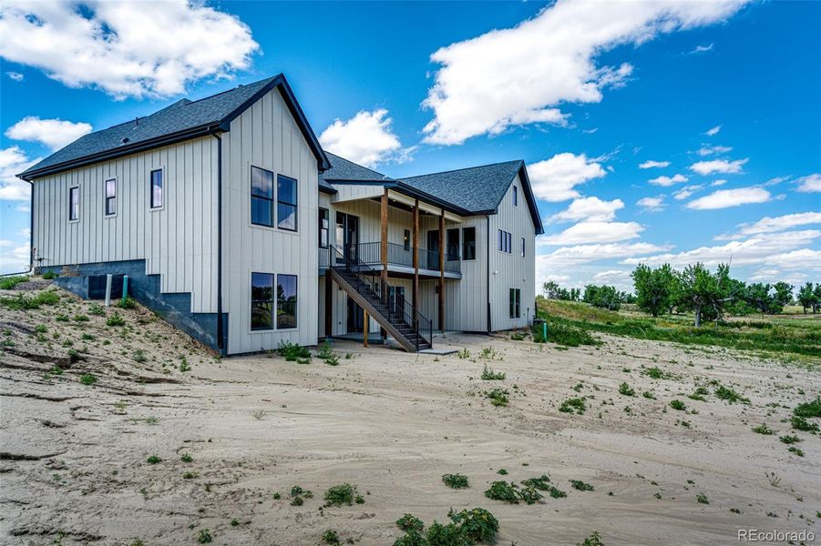 Front exterior of a new home in , Byers, CO, highlighting curb appeal (Image 27).