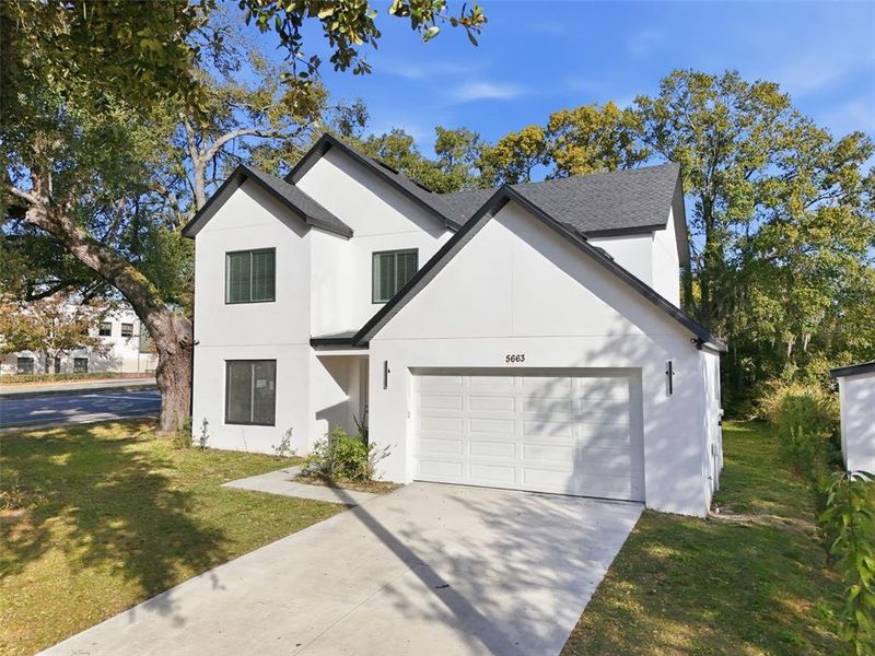 Front exterior of a new home in , Orlando, FL, highlighting curb appeal (Image 1). Front exterior of a new home in , Orlando, FL, highlighting curb appeal (Image 1).