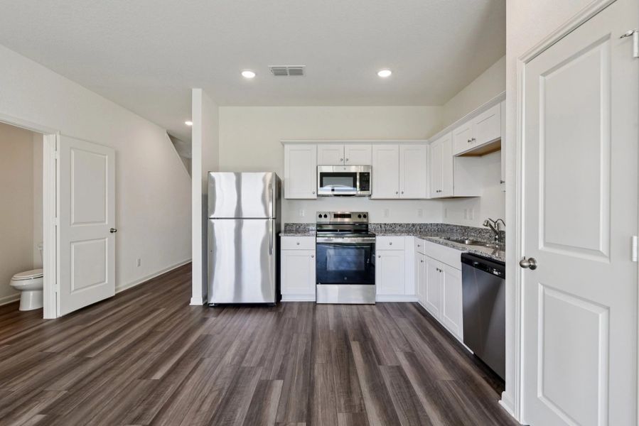 Representative furnished interior of a home built from the Compass by Starlight Homes in The Wilder, Adkins (Image 10).