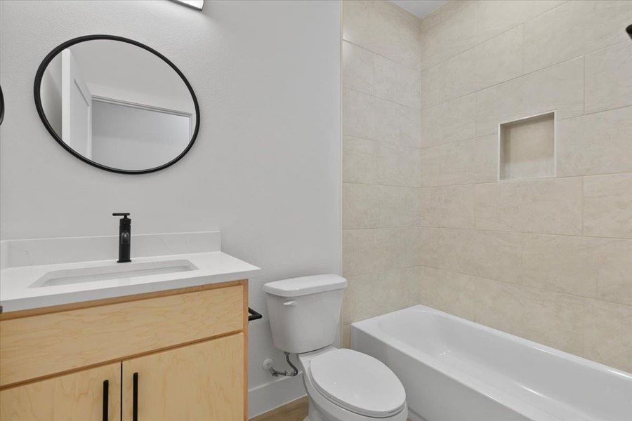 Full bathroom with vanity and bathing tub / shower combination Full bathroom with vanity and bathing tub / shower combination