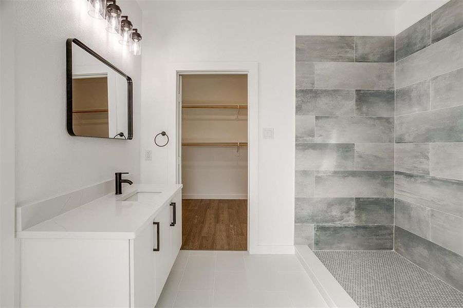 Bathroom with tile patterned floors and vanity Bathroom with tile patterned floors and vanity