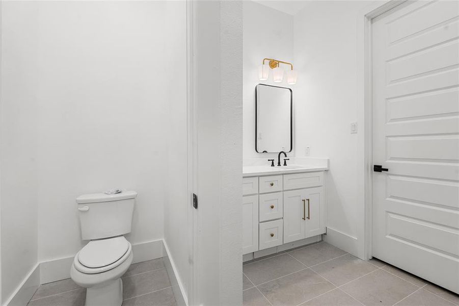 Bathroom with vanity and light tile patterned floors Bathroom with vanity and light tile patterned floors