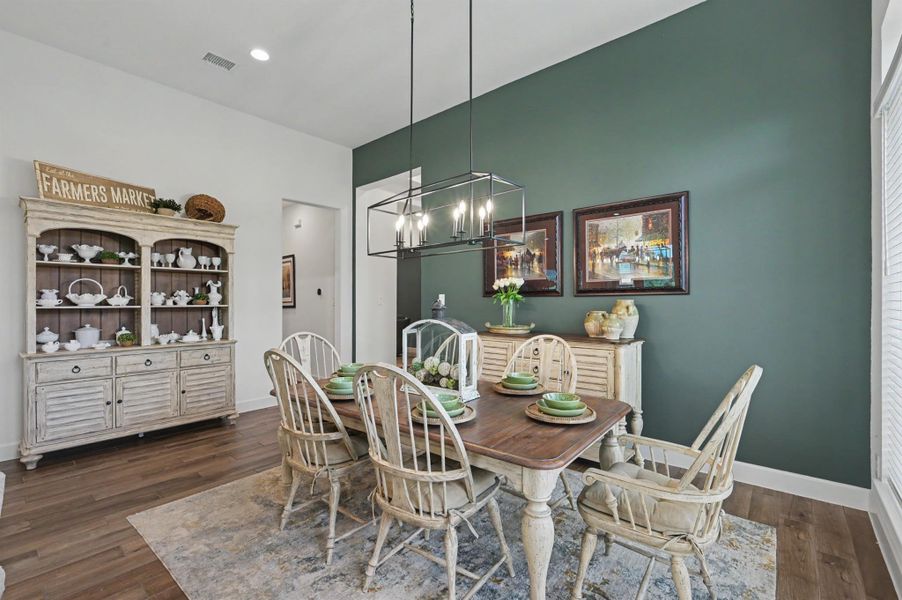 The dining area has recessed lighting, an accent wall, and an upgraded chandelier. Stunning, upgraded lighting selections throughout the home. The dining area has recessed lighting, an accent wall, and an upgraded chandelier. Stunning, upgraded lighting selections throughout the home.