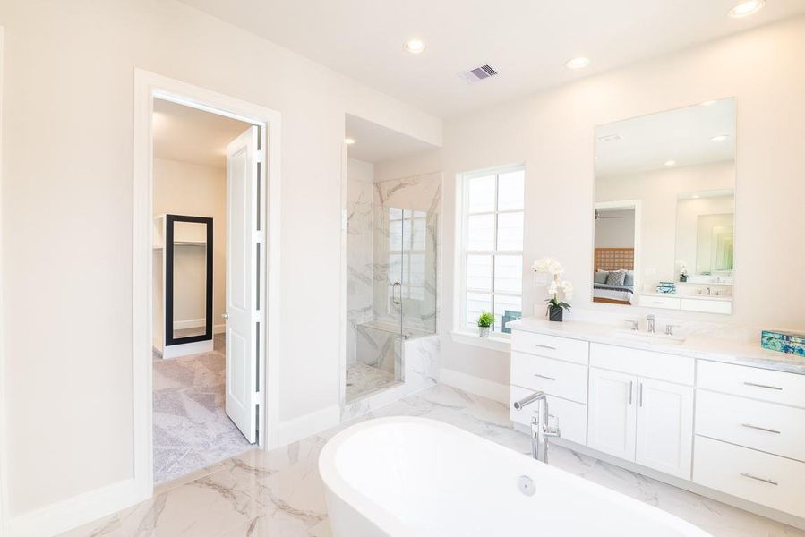 Primary bath is so spacious and love the huge shower with bench seat.