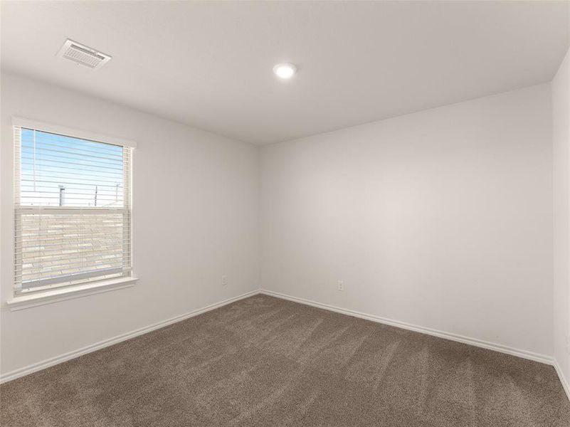 Empty room with carpet floors